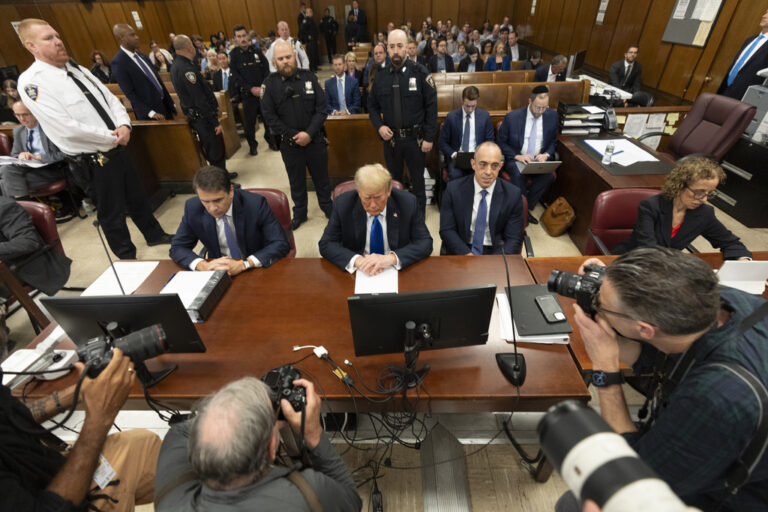 Donald Trump photographed in a courtroom.
