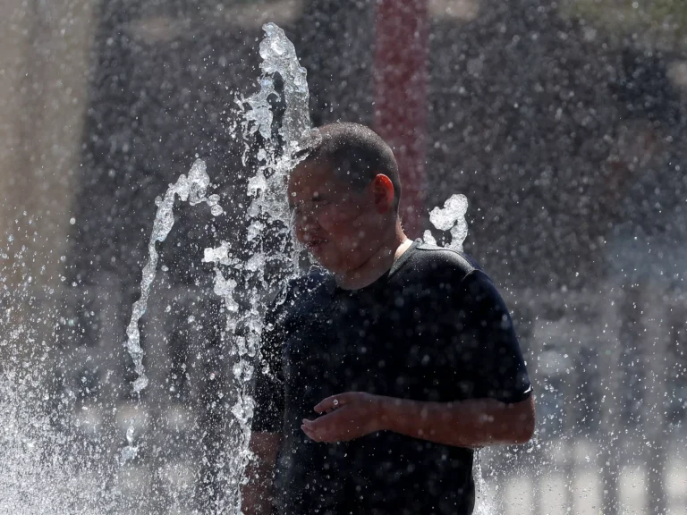 A boy plays in a splash pad at Riverview Park on June 5 in Mesa, Ariz.