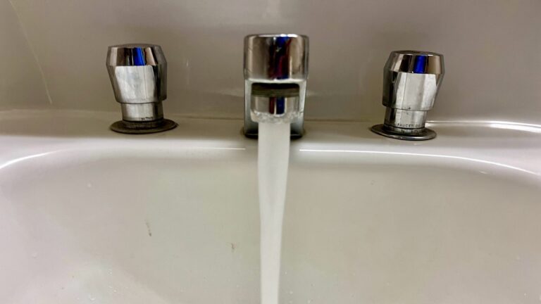 water coming out of a faucet