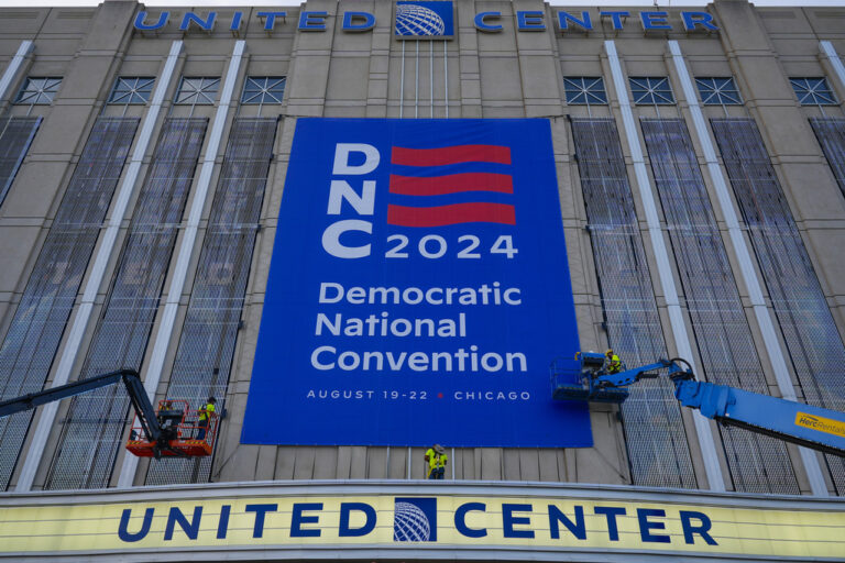 banner being installed on building