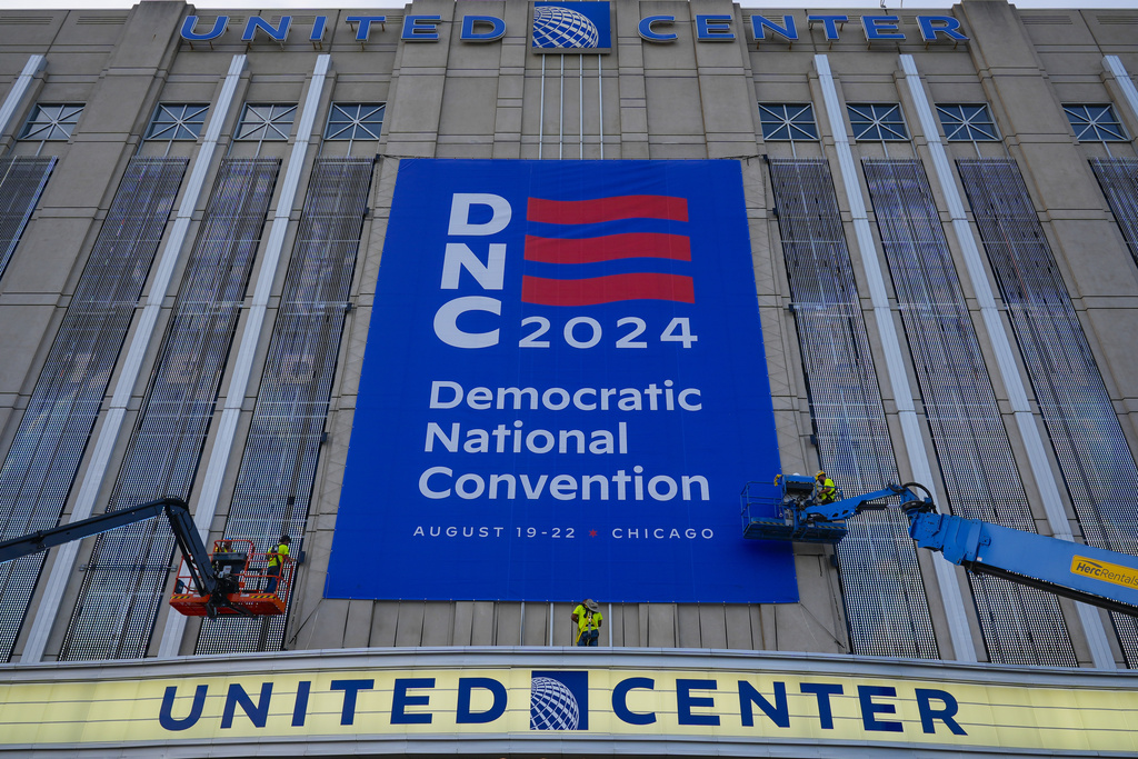 banner being installed on building