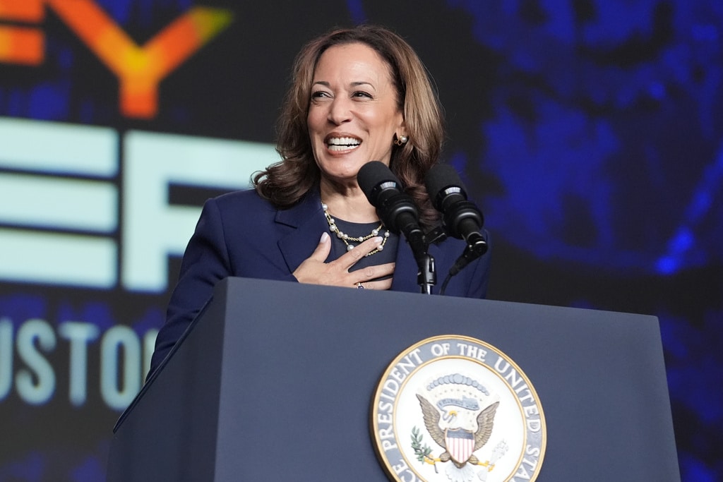 smiling woman at a podium