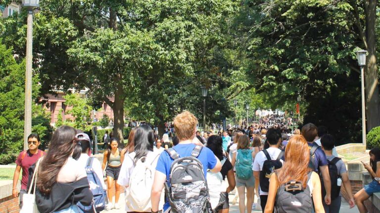 Students fills a sidewalk leading to the University of Illinois Quad in Urbana-Champaign on August 26, 2024.