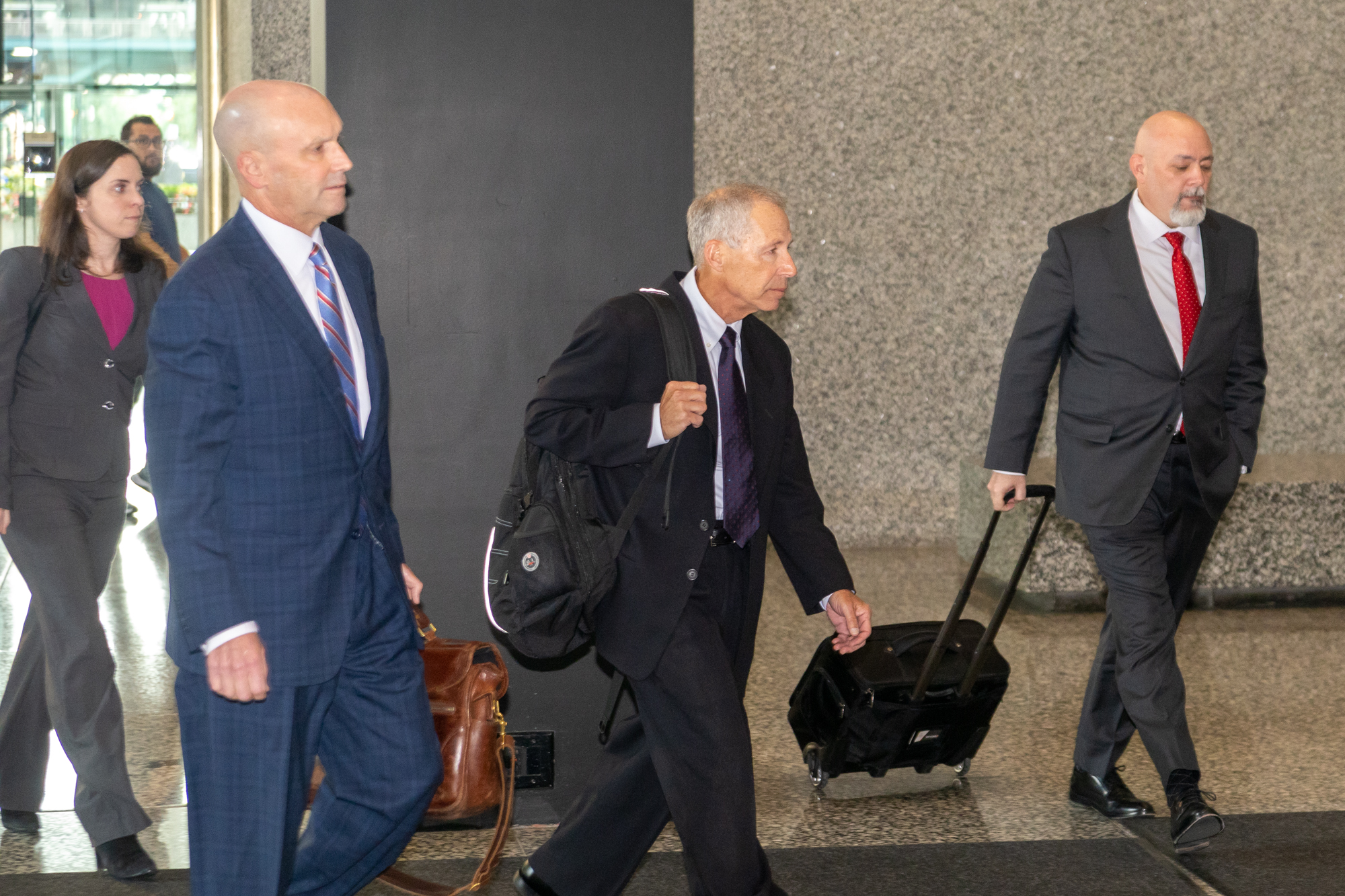 Men walking through courthouse