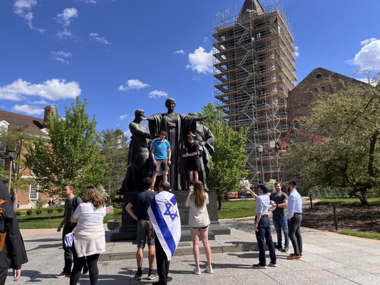 people gathered around statue