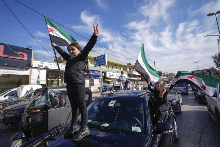 celebrating child stands on top of car