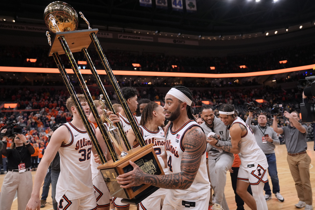 basketball player holds trophy