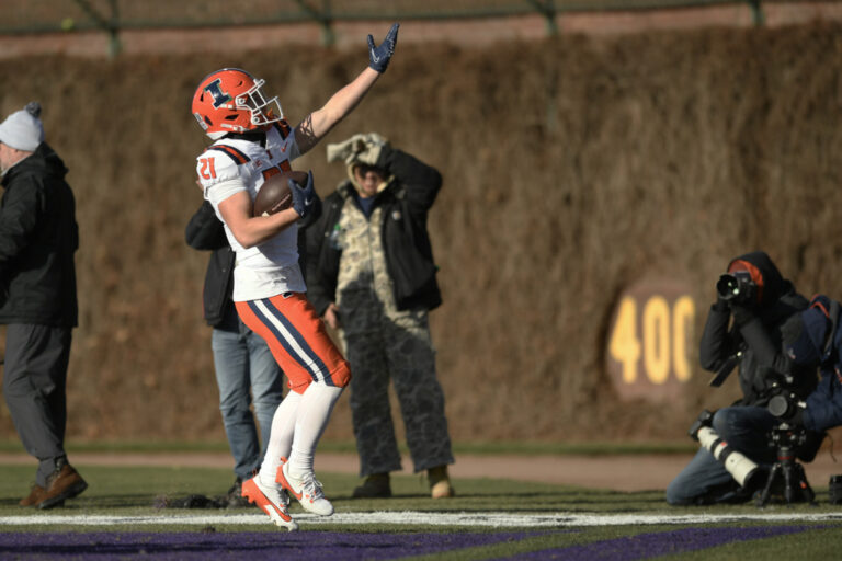 football player holds ball