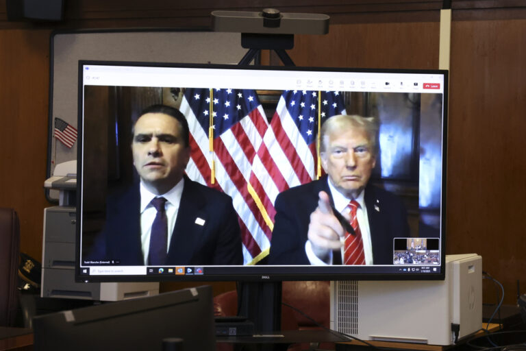 two men on a tv monitor