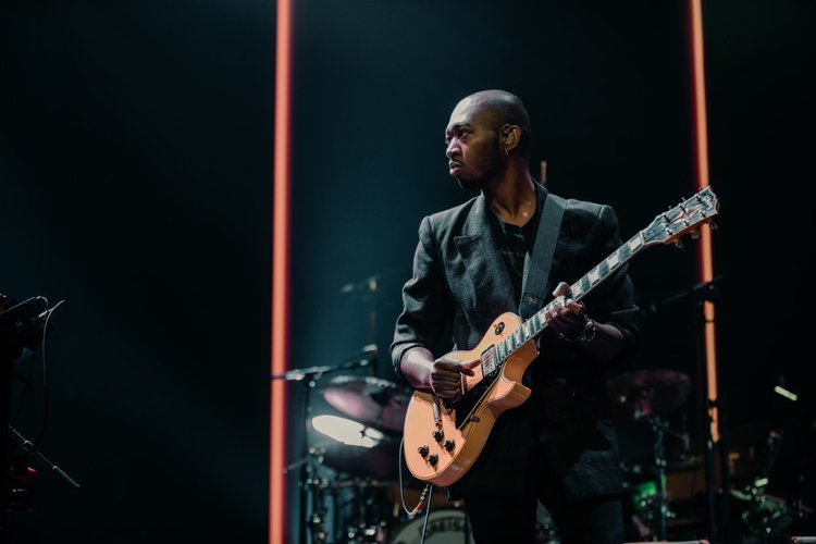 A man playing a guitar