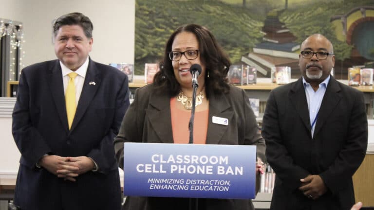 From left: Gov. JB Pritzker, Champaign Superintendent Shelia Boozer, Centennial High School teacher Mark Sikora.