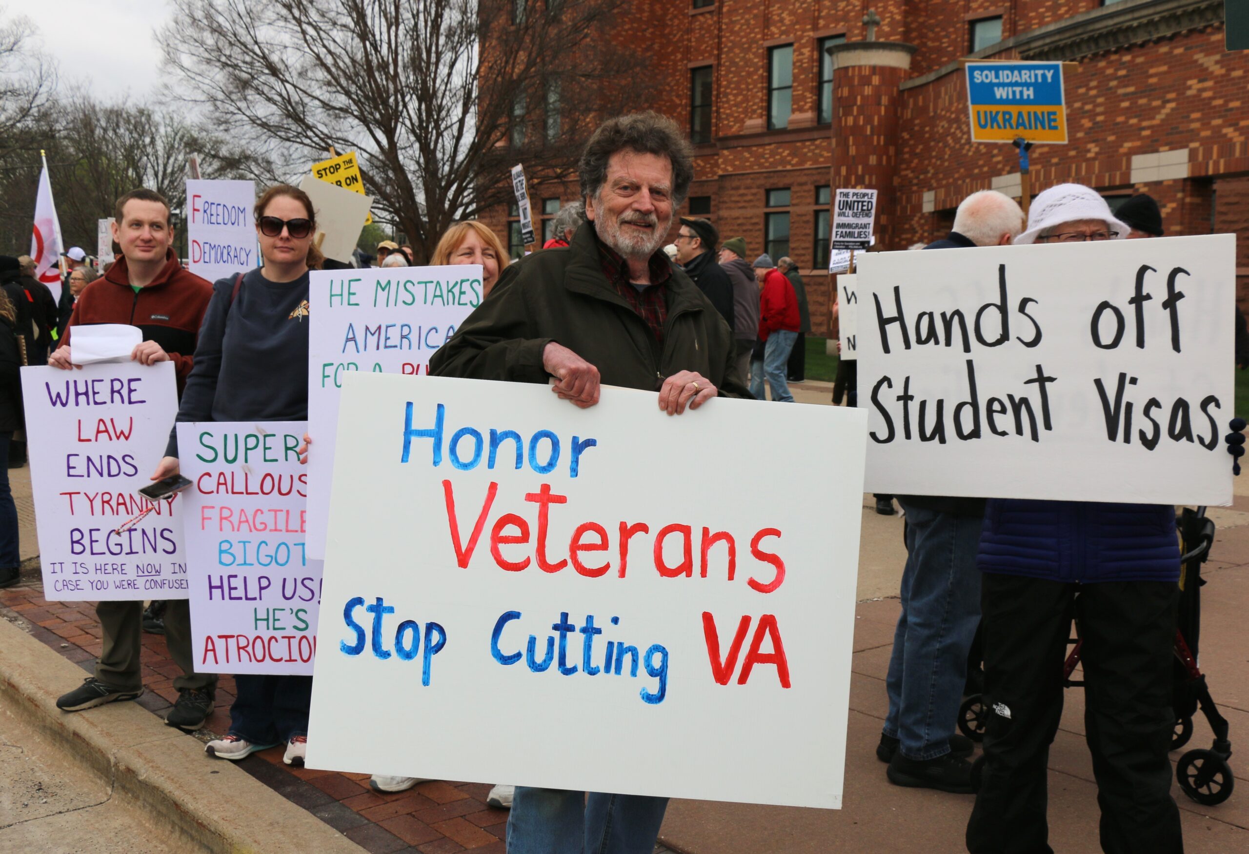 demonstrators holding signs