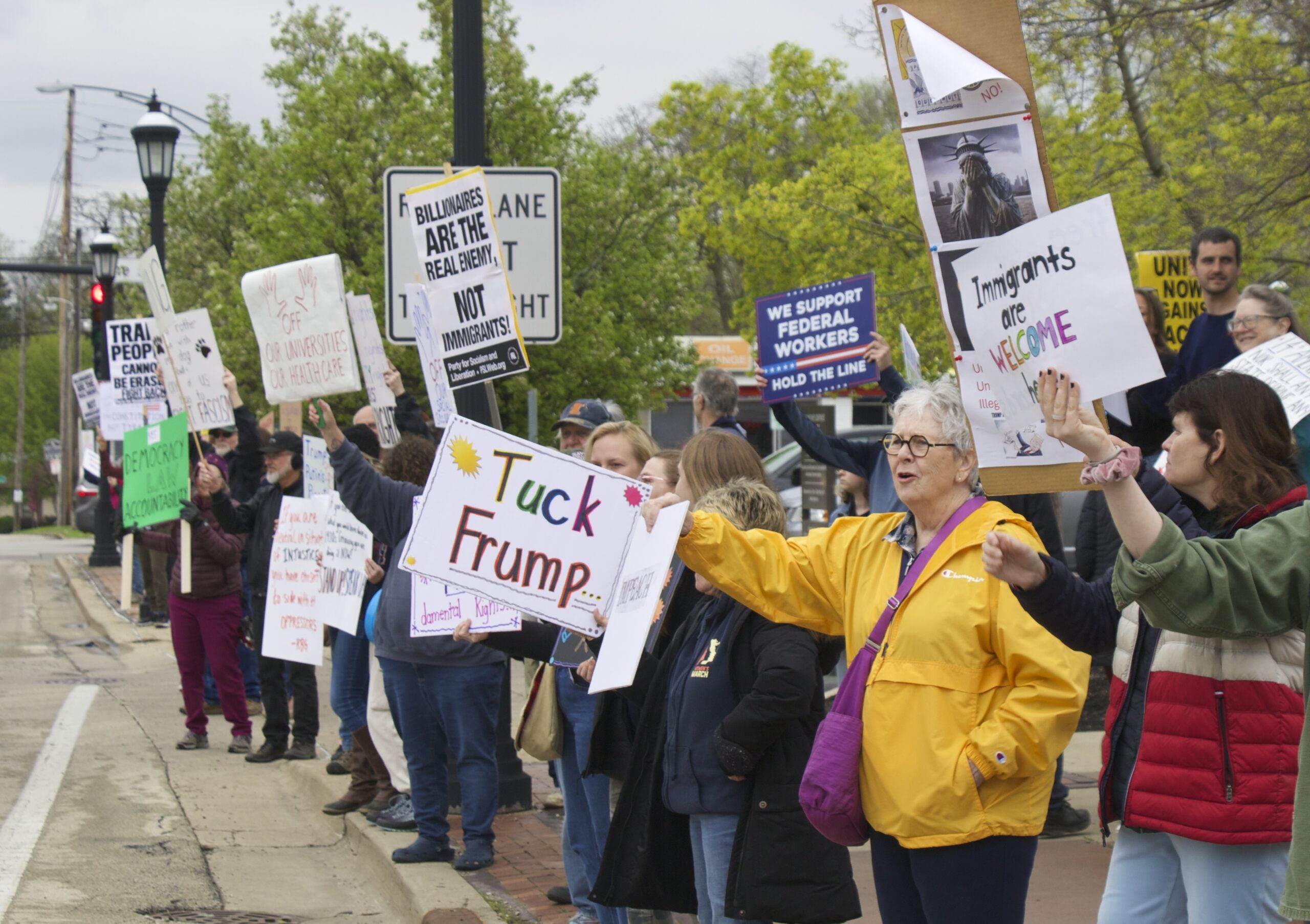 demonstrators holding signs