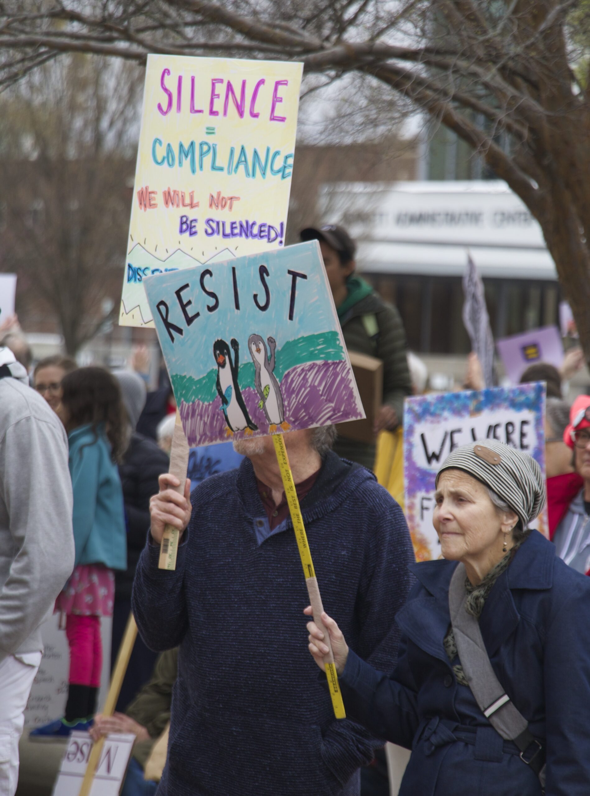 demonstrators holding signs