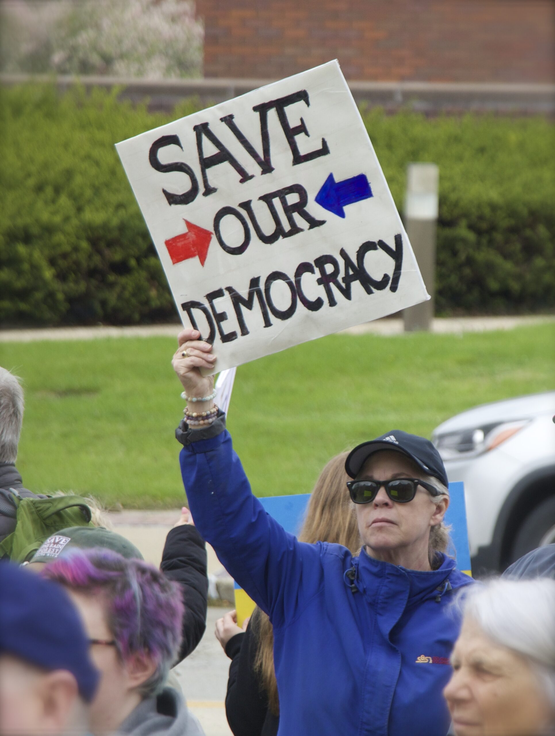 demonstrator holding sign