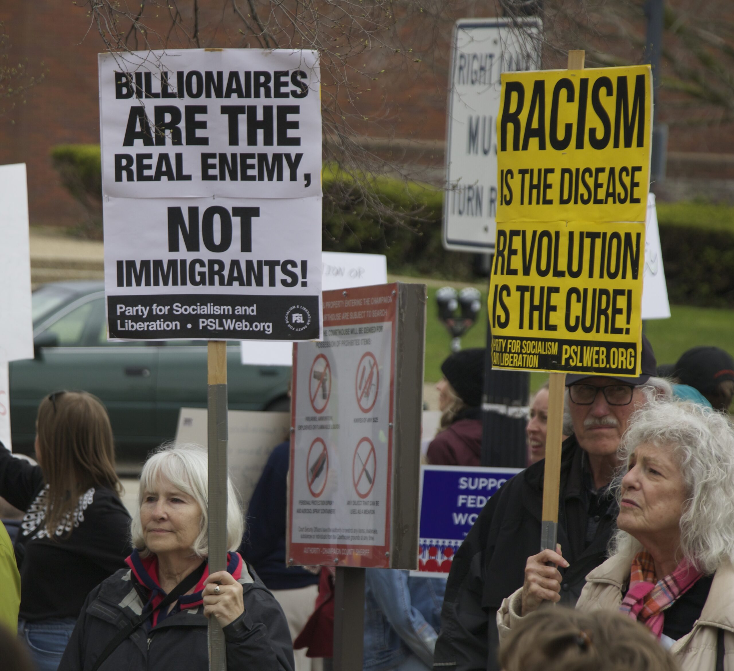 demonstrators holding signs