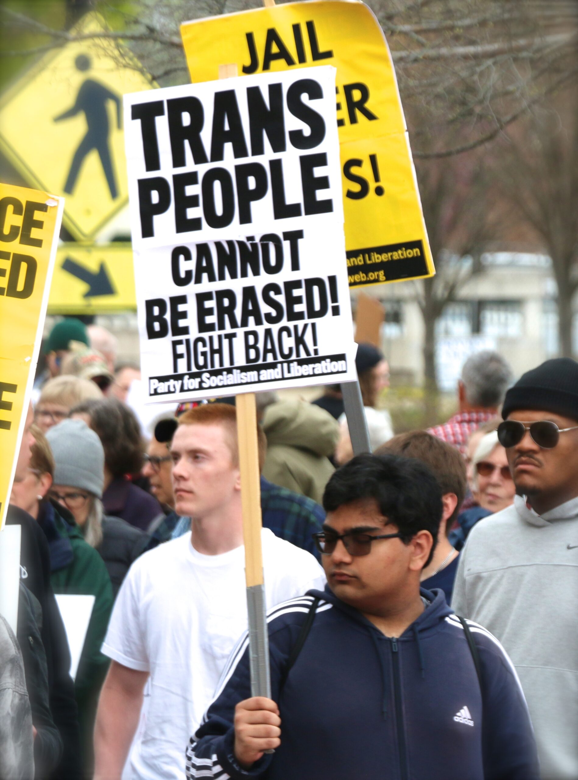 demonstrators holding signs