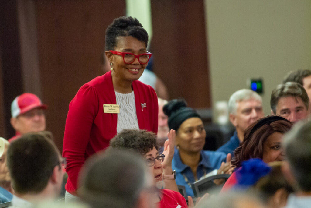 woman stands in crowd