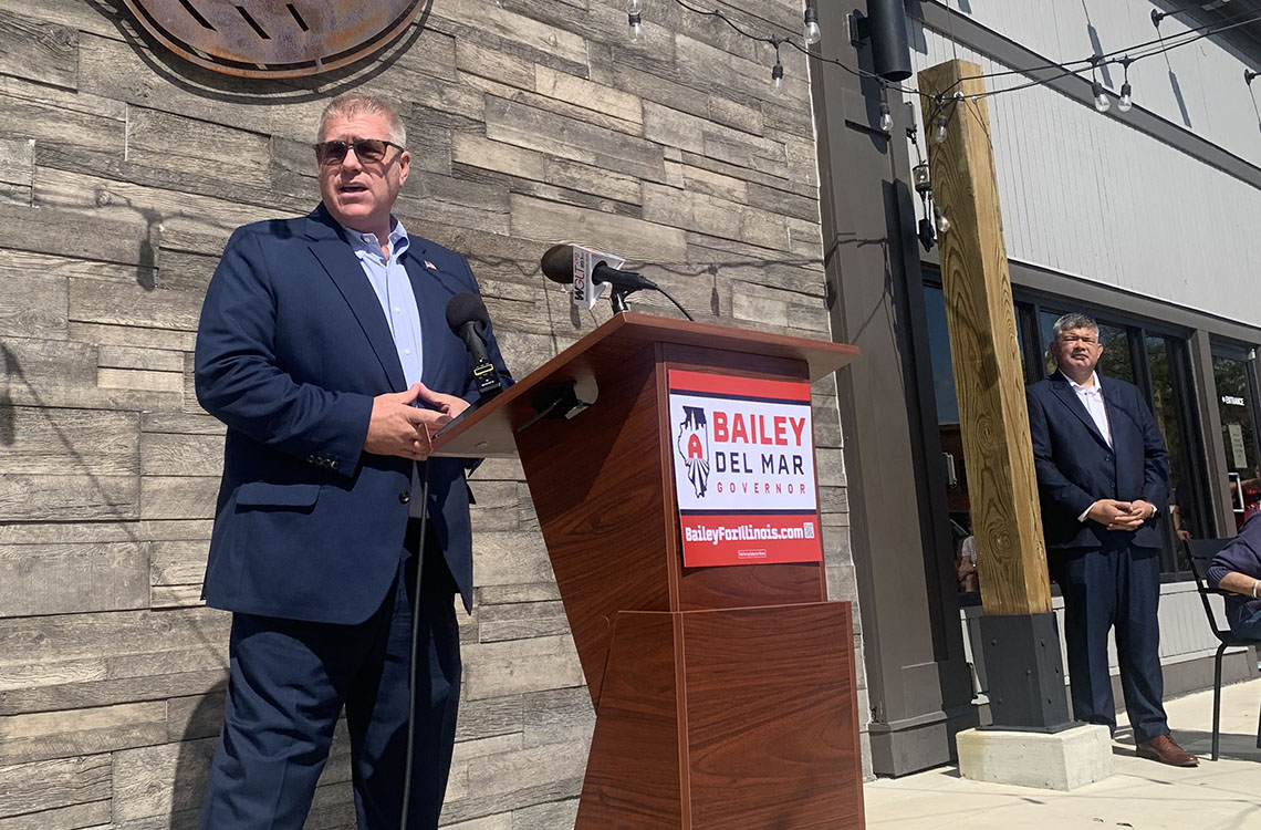 Former Republican State Sen. Darren Bailey speaks to supporters at a rally in Bloomington to open his 2026 campaign for governor on Thursday, Sept. 25, 2025. Bailey named Cook County Republican Party Chair Aaron Del Mar, right, as his running mate.
