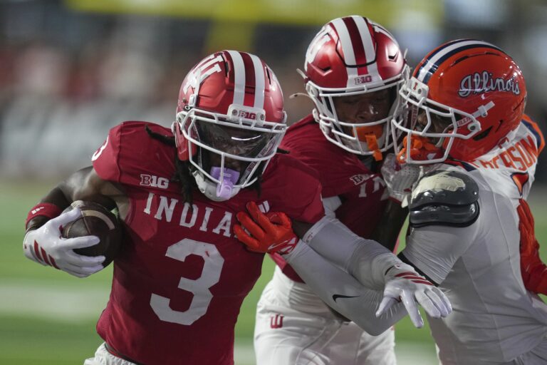 Indiana wide receiver Omar Cooper Jr. (3) runs past Illinois defensive back Kaleb Patterson for a touchdown during the first half of an NCAA college football game, Saturday, Sept. 20, 2025, in Bloomington, Ind. (AP Photo/Darron Cummings)