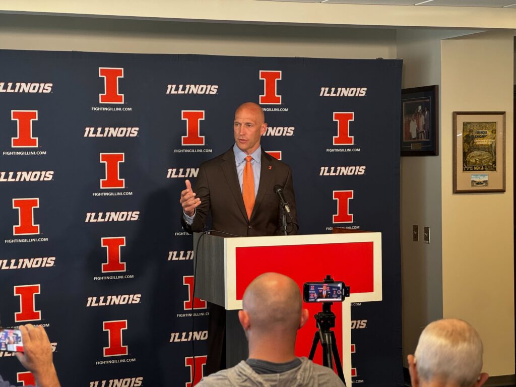man speaking at podium