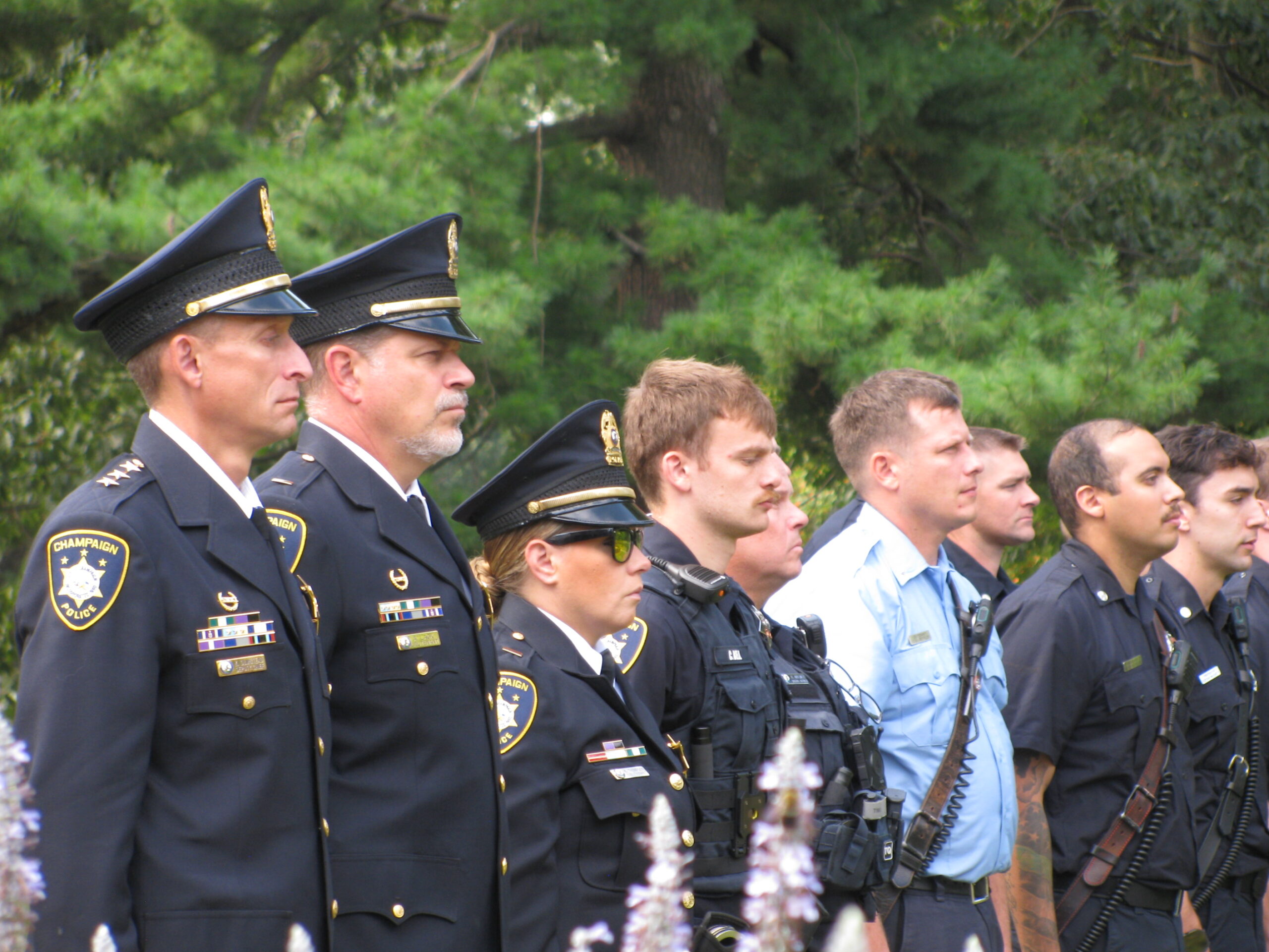Champaign police officers standing in attendance at the ceremony.