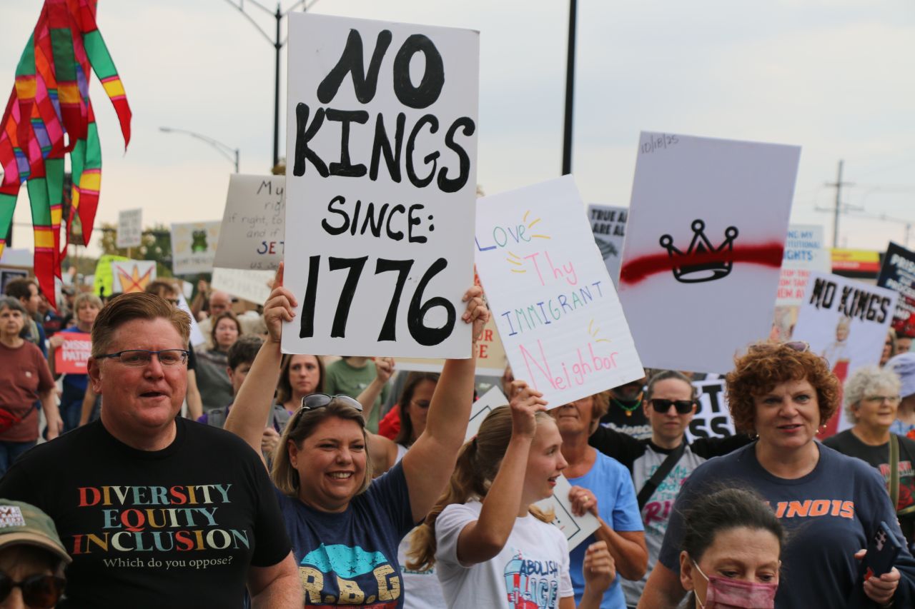 protesters holding signs