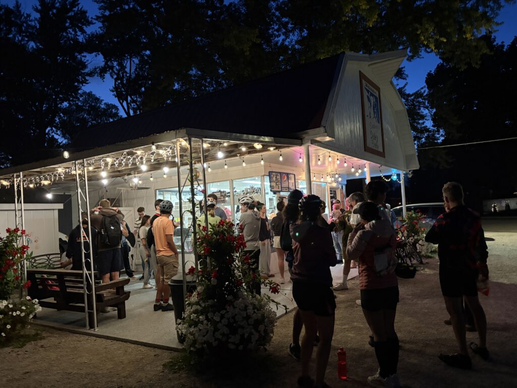 Cyclists hang out at the Sidney Dairy Barn.
