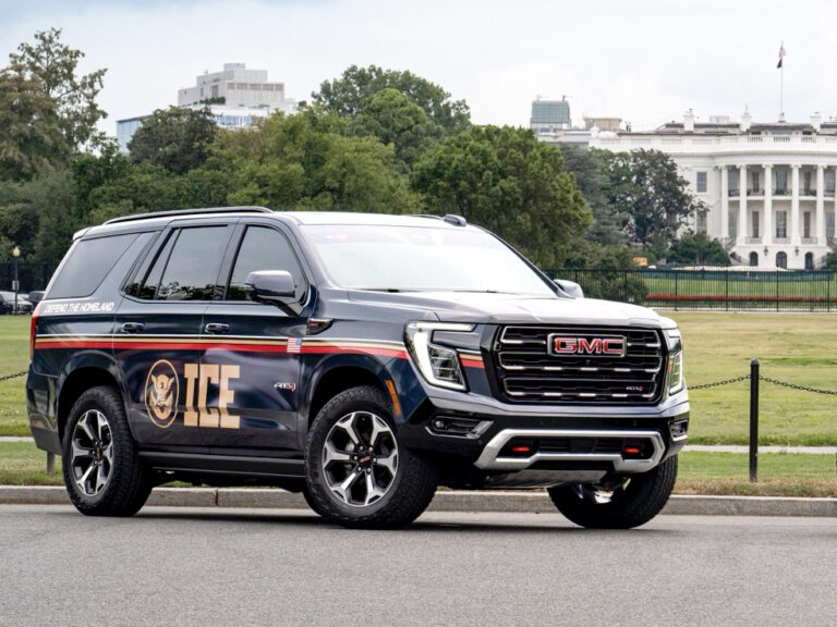 a navy SUV with the letters "ICE" on the side