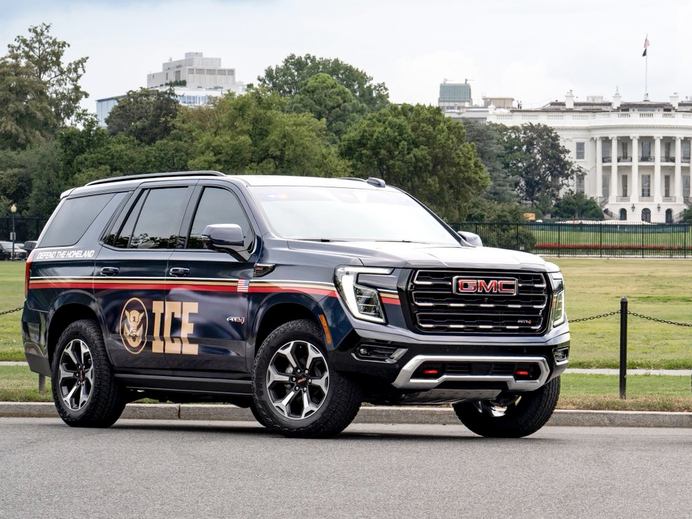 a navy SUV with the letters "ICE" on the side