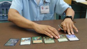Antonio Jones fans out the set of Magic: The Gathering cards he keeps in his pocket.