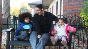 Taishana Brown picked up her kids, Legend (left) and Legacy (right), from Head Start Wednesday, and picked up a box of food at the same time.