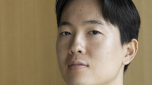 A close-up view of a young man's face.