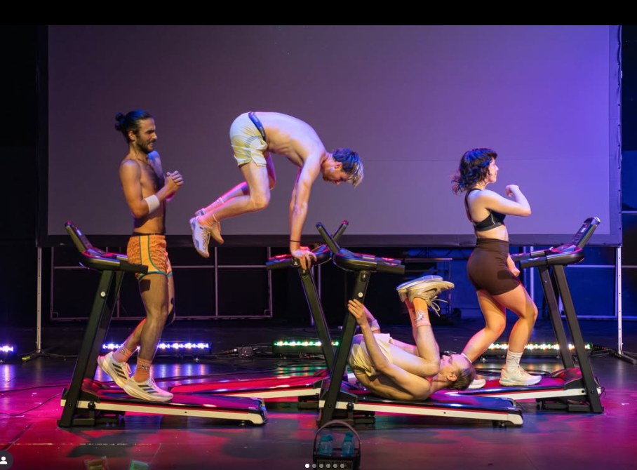 Four people stand on, lay on, and balance on treadmills on a stage.