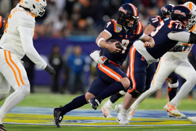 Illinois quarterback Luke Altmyer (9) runs the ball during the first half of the Music City Bowl NCAA college football game against Tennessee, Tuesday, Dec. 30, 2025, in Nashville, Tenn.