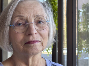 a woman poses for a photo