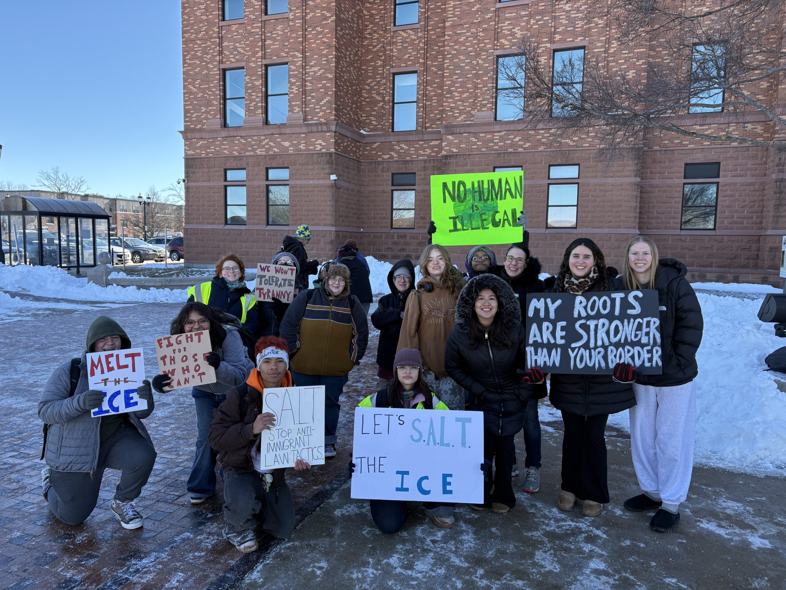 Urbana High School students pose in front of the Champaign County Courthouse