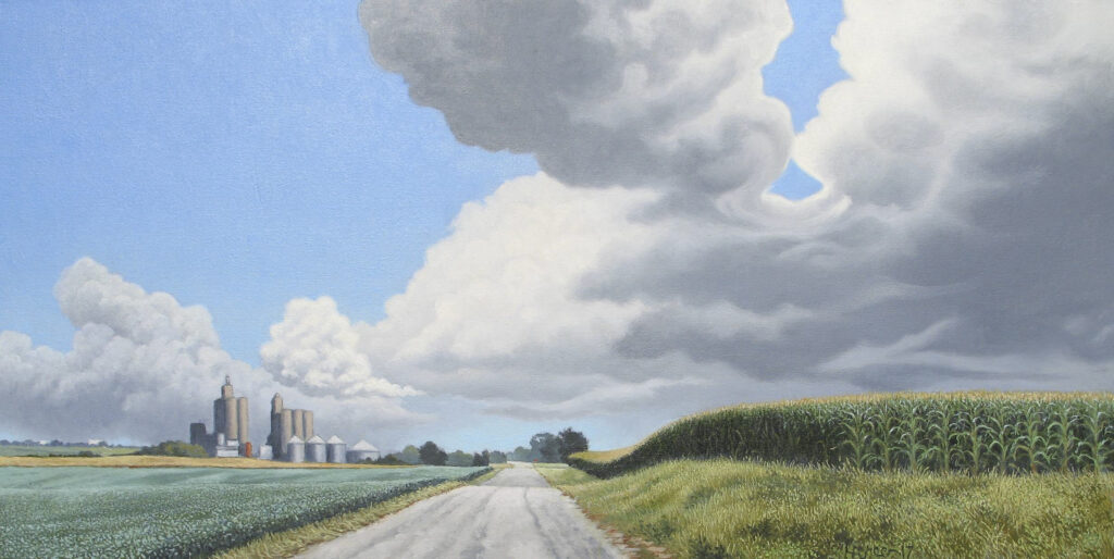A wide, landscape oil painting depicts a country road lined by corn and soy bean fields. Grain bins are painted in the distance to the left of the road.