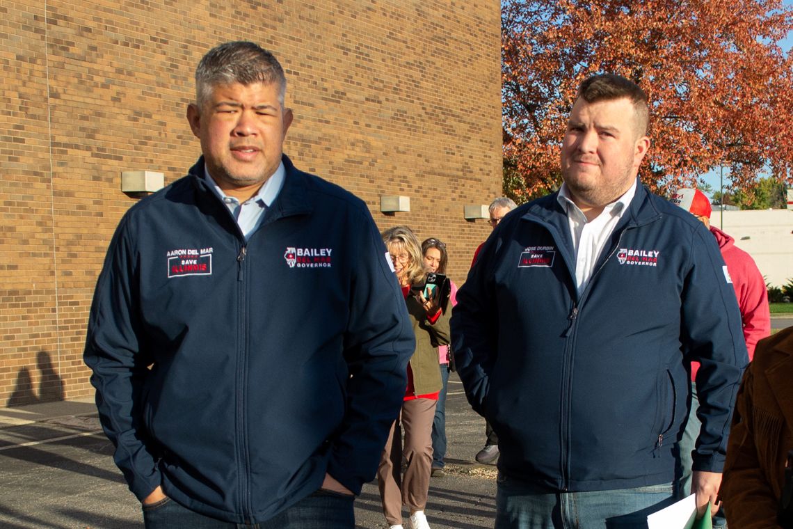 two men standing next to each other