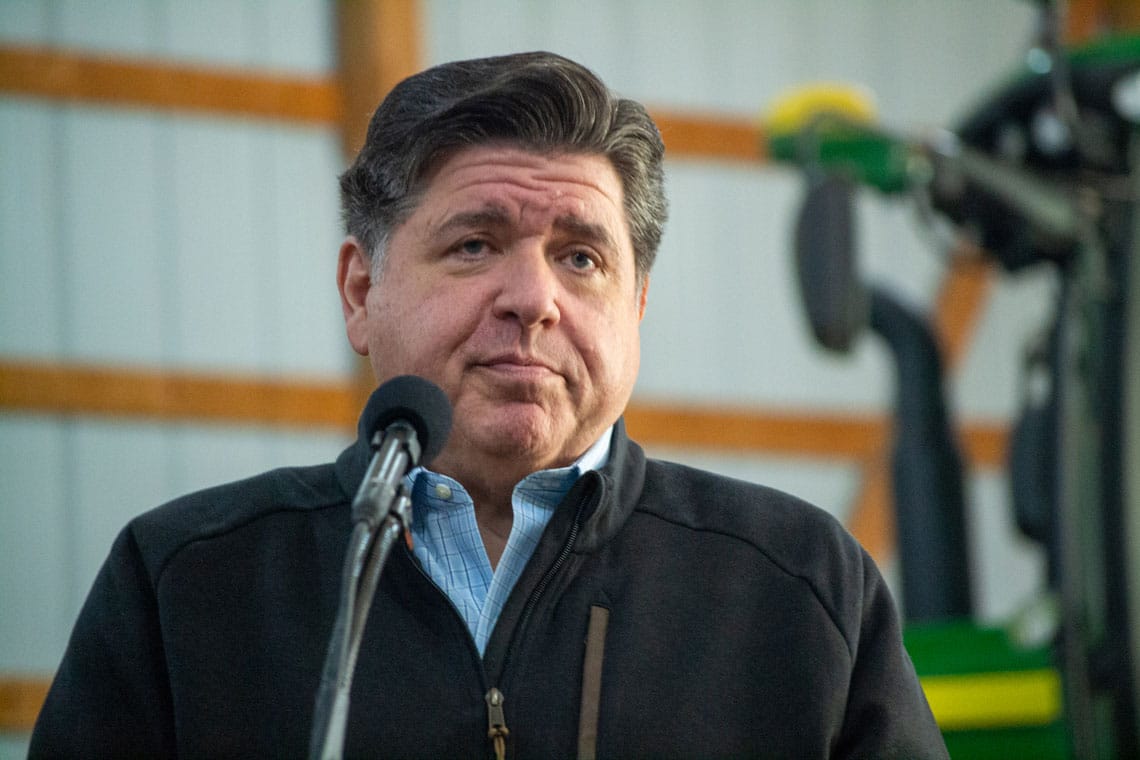 Gov. JB Pritzker takes questions from a reporter in October 2025.