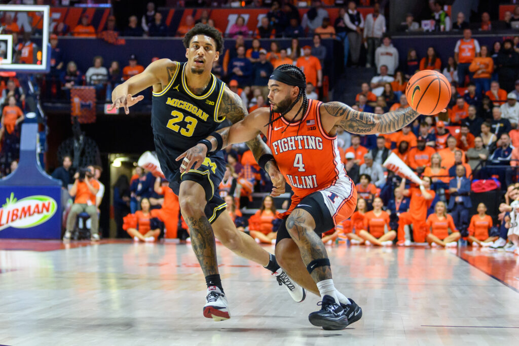 Illinois' Kylan Boswell (4) drives against Michigan's Yaxel Lendeborg (23) during an NCAA college basketball game Friday, Feb. 27, 2026, in Champaign, Ill.