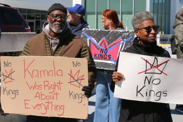 protesters holding signs