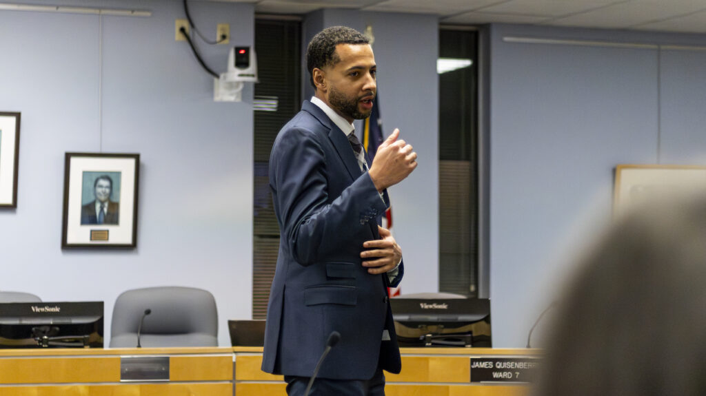 A man speaks into a microphone