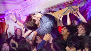 A person crowdsurfing