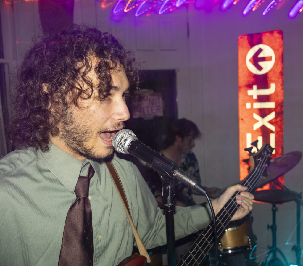 a person sings and plays guitar