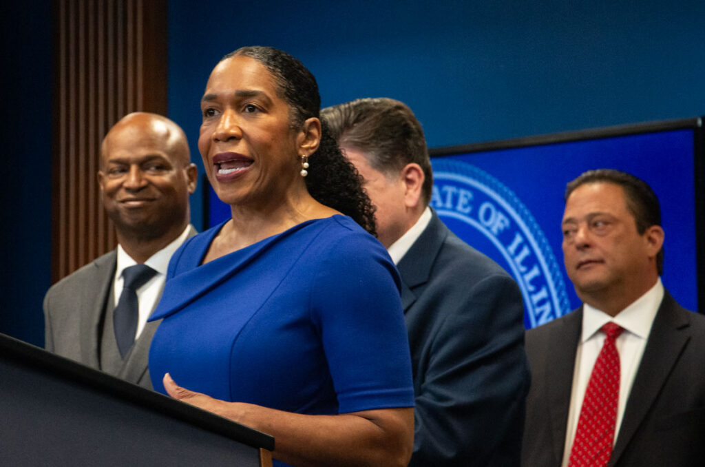 woman speaks at podium