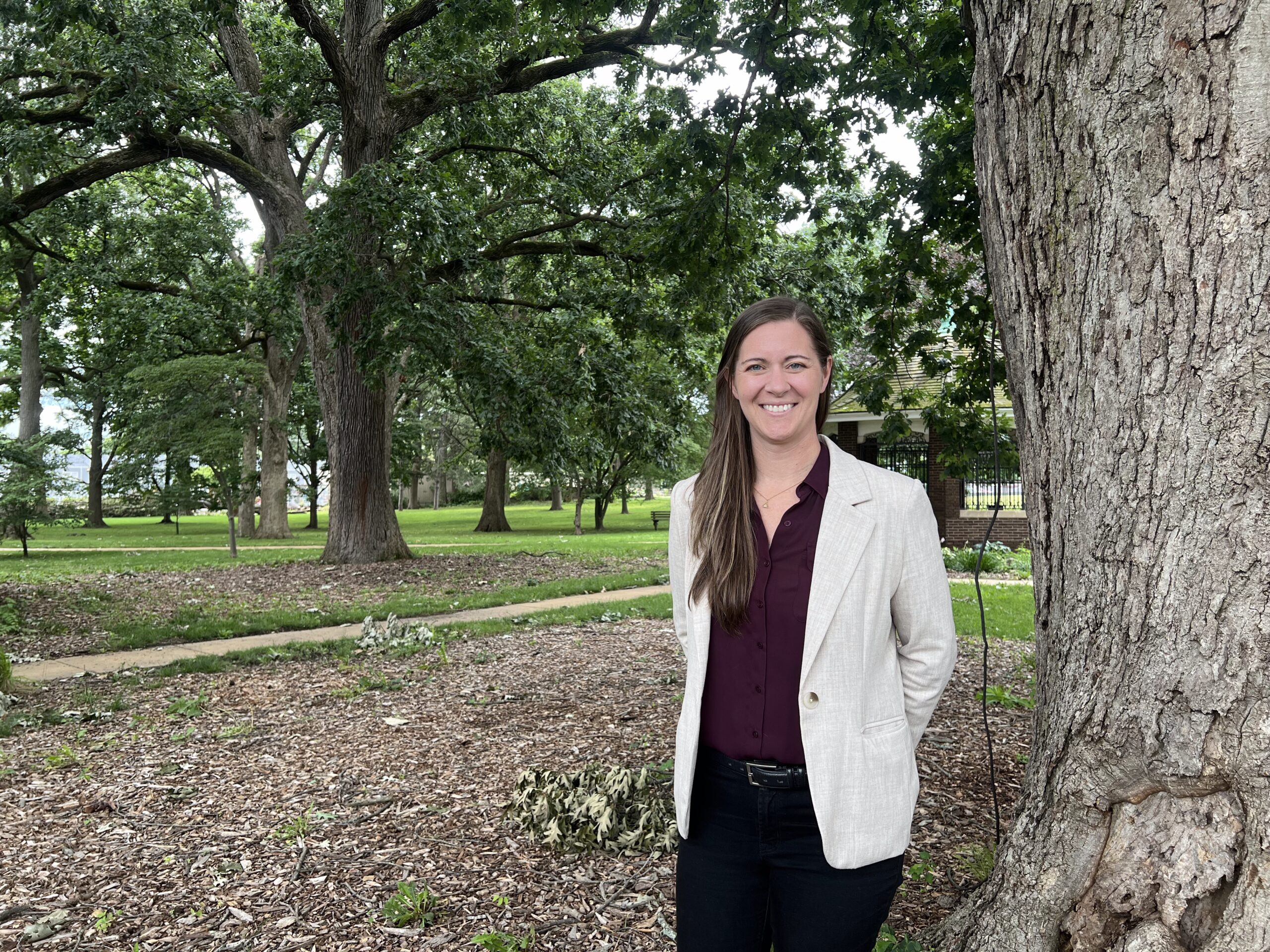 Rachel Lenz standing next to tree older than the U.S. Constitution
