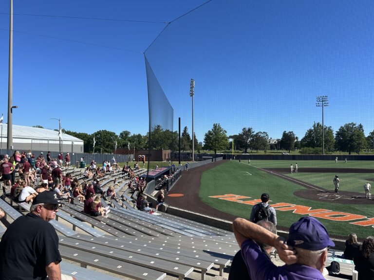 Families sit in stands at Illinois Field