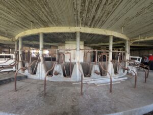 A circle of aged cow stalls.