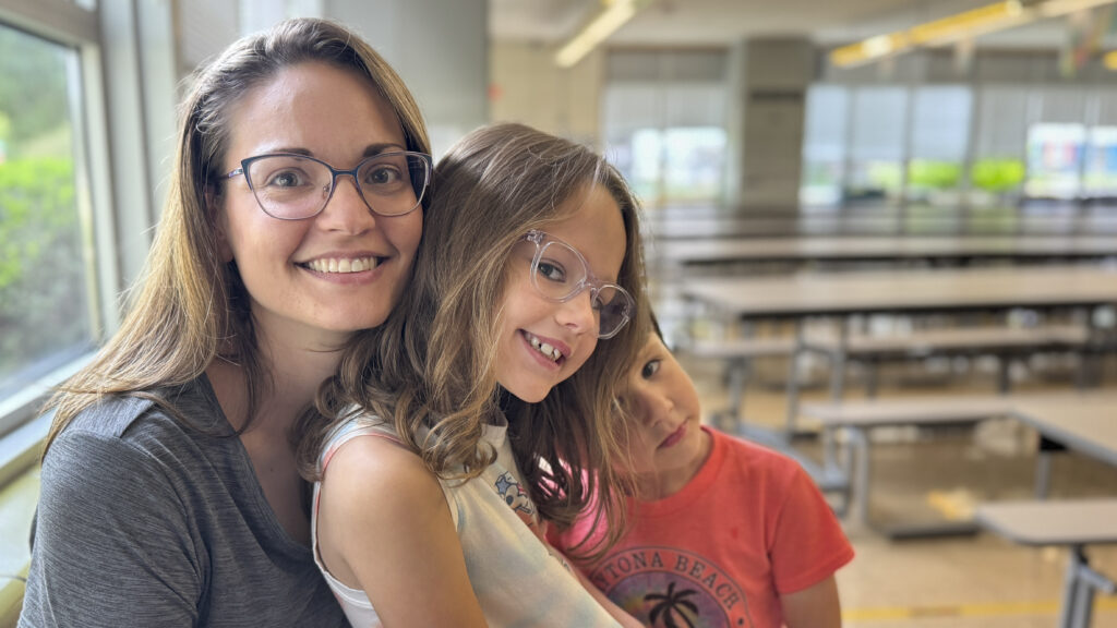a woman and a child pose for a photo